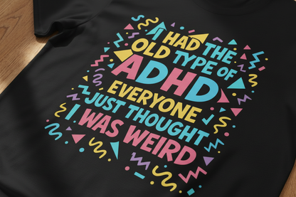 Close-up of colourful ADHD typography print on black t-shirt fabric